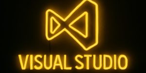 visual Studio 마크를 검은색 배경으로 노란색 네온사인